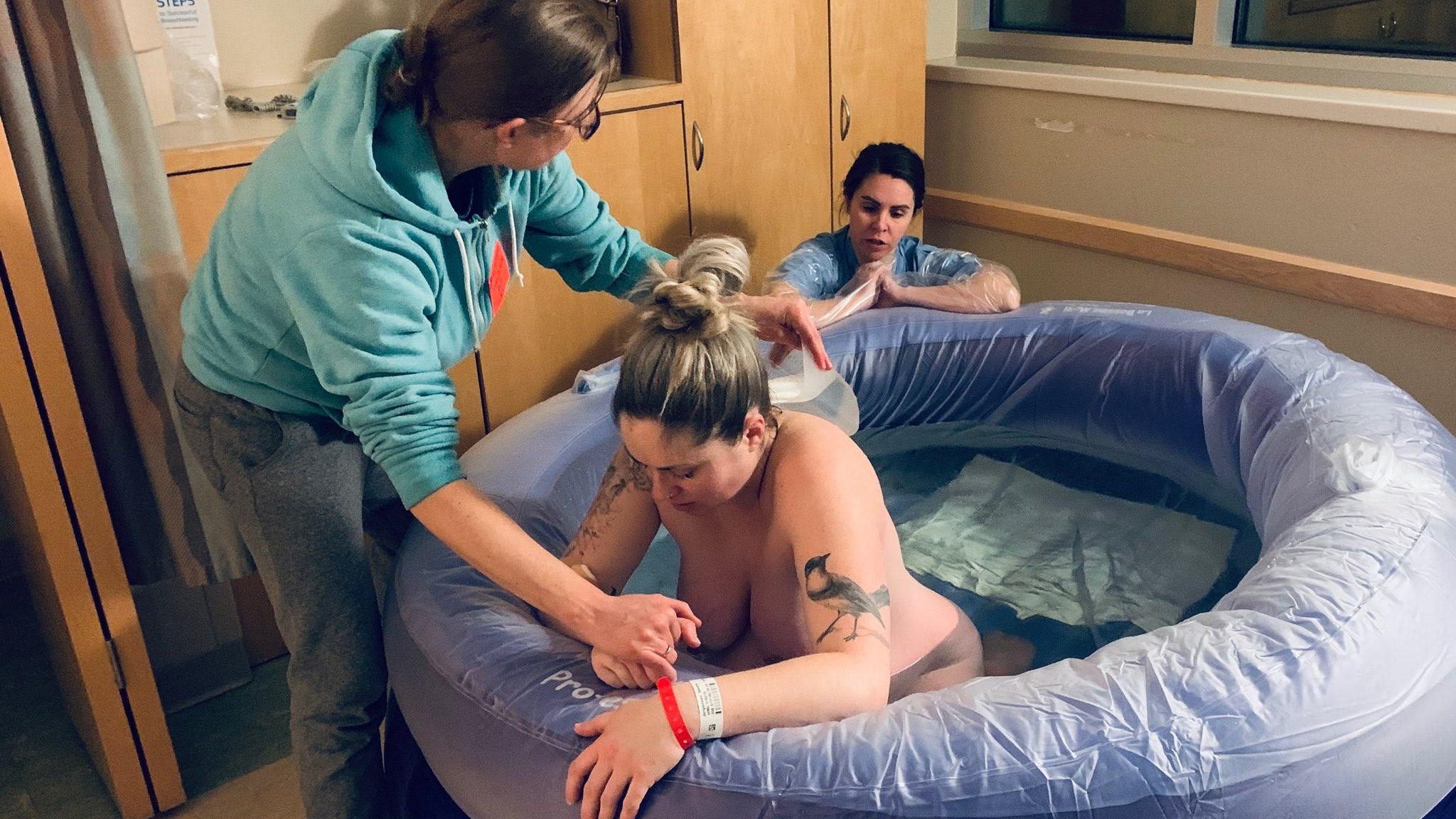 twin cities full spectrum doula assisting in hospital water birth